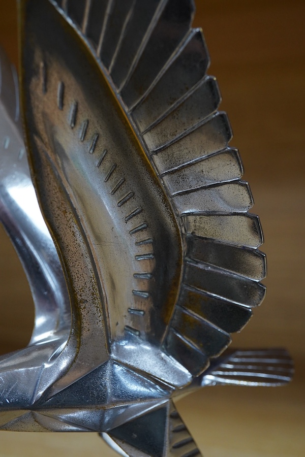 A 1920s/30s French Art Deco ‘eagle on a globe’ car mascot by Casimir Brau for the car manufacturer Messier, mounted to a threaded radiator cap, height 23cm. Condition - good.